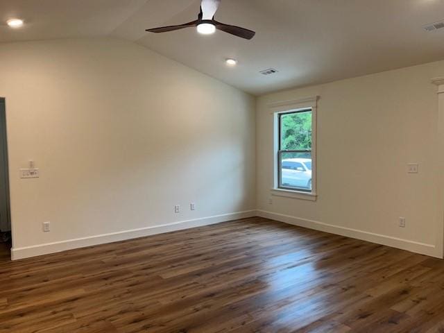 unfurnished room with dark wood-type flooring, vaulted ceiling, and ceiling fan