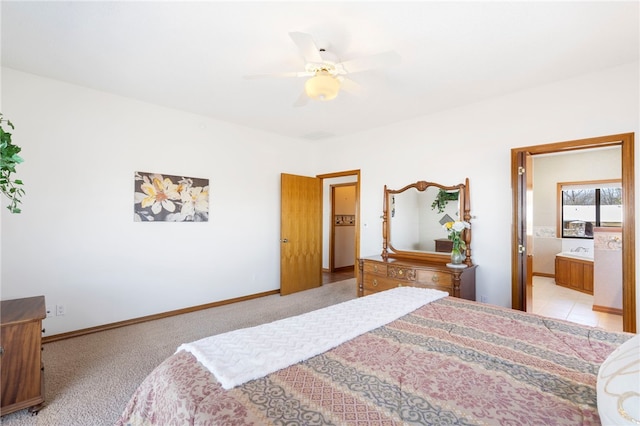 21330 Ridgeview Dr, Garfield, AR 72732 - bedroom with light colored carpet, ensuite bathroom, a ceiling fan, and baseboards