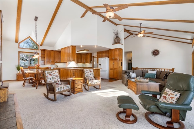 21330 Ridgeview Dr, Garfield, AR 72732 - living room featuring ceiling fan, high vaulted ceiling, light colored carpet, and beamed ceiling