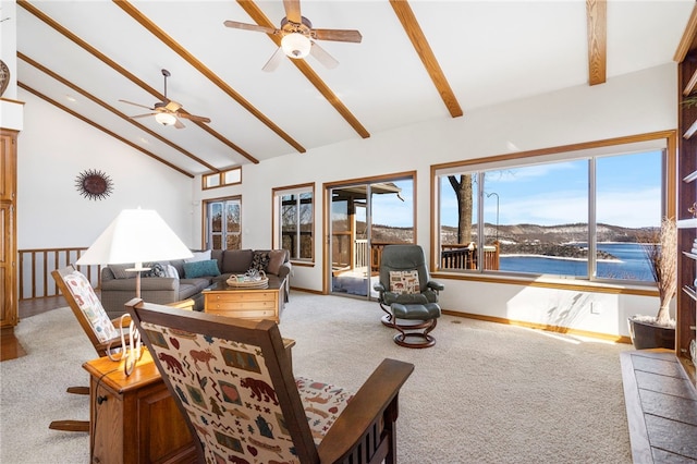 21330 Ridgeview Dr, Garfield, AR 72732 - living room with light colored carpet, a ceiling fan, beamed ceiling, high vaulted ceiling, and a water view