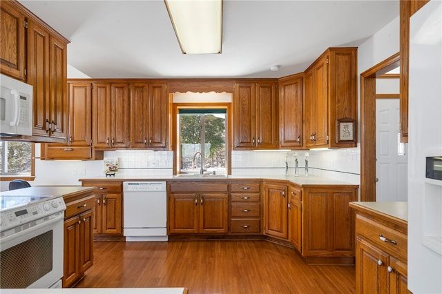 21330 Ridgeview Dr, Garfield, AR 72732 - kitchen with white appliances, a sink, light countertops, and brown cabinets