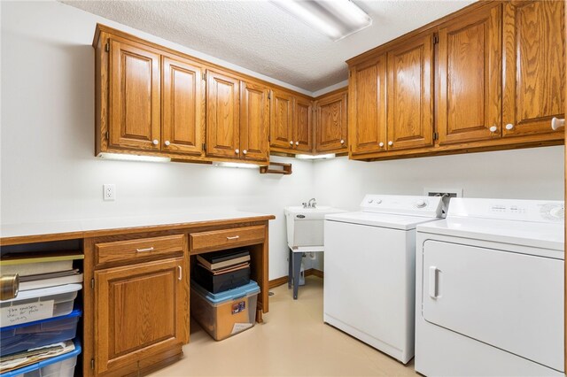 21330 Ridgeview Dr, Garfield, AR 72732 - laundry room featuring washer and clothes dryer, cabinet space, and a textured ceiling