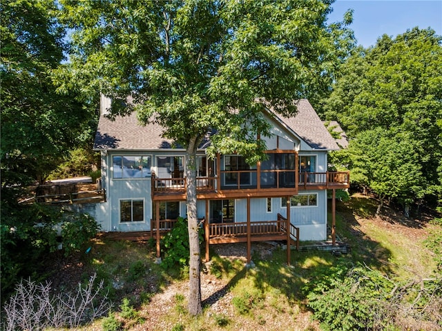 21330 Ridgeview Dr, Garfield, AR 72732 - rear view of house with a wooden deck, a shingled roof, and a sunroom