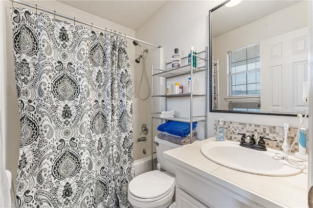 full bathroom with backsplash, vanity, toilet, a textured ceiling, and shower / bath combo with shower curtain