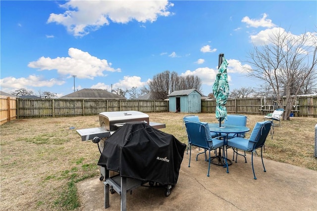 view of patio / terrace featuring grilling area and a storage unit