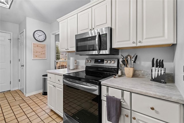 kitchen featuring white cabinetry and appliances with stainless steel finishes