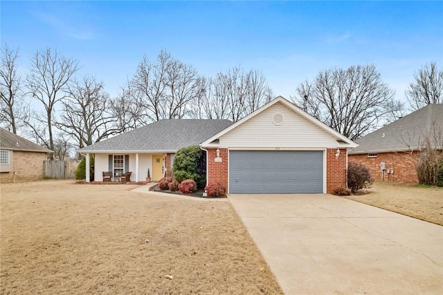 single story home with a garage and covered porch