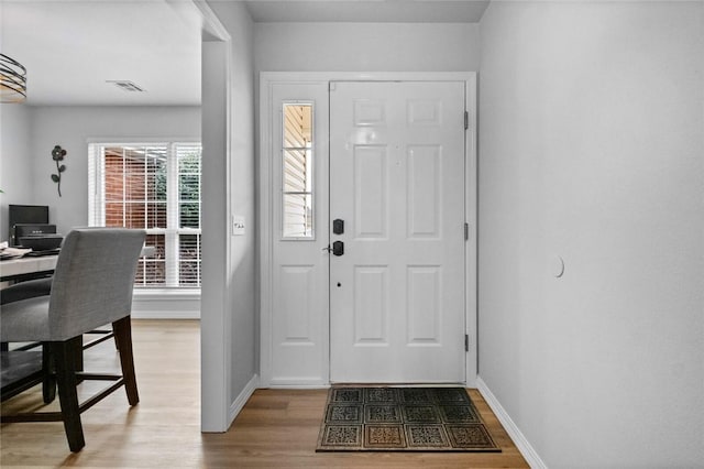 foyer with hardwood / wood-style flooring