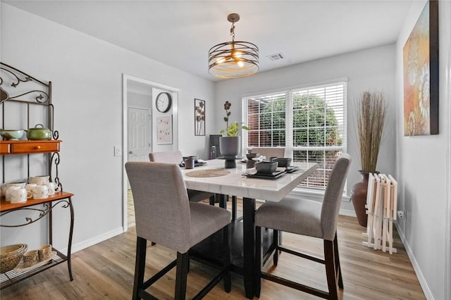 dining area with light wood-type flooring