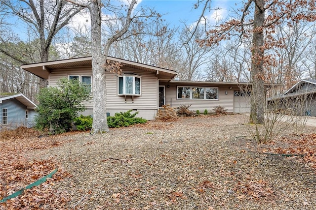 view of front of home with driveway and an attached garage