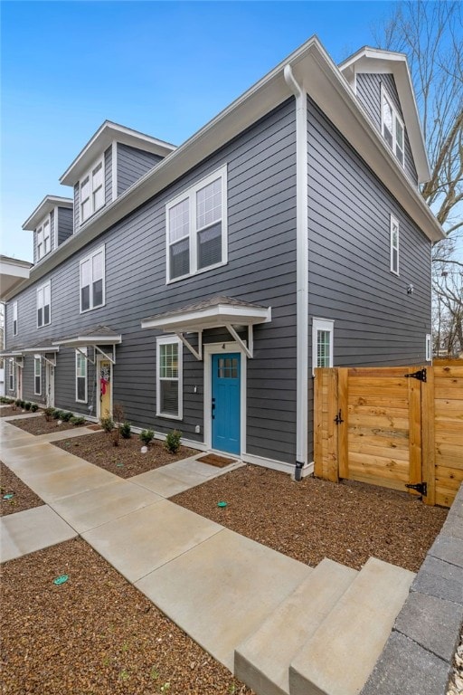 view of front of property featuring a gate