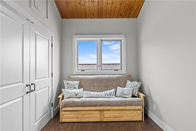 living area with dark hardwood / wood-style flooring and wooden ceiling