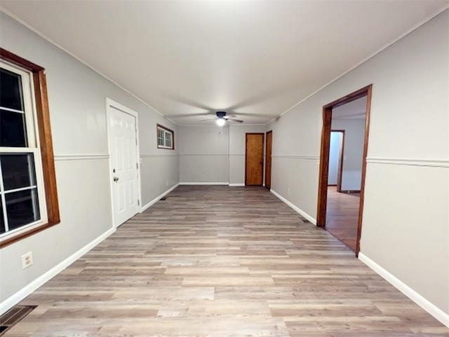 spare room featuring ceiling fan and light wood-type flooring