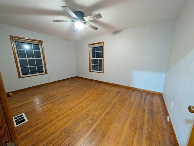 spare room featuring ceiling fan and light hardwood / wood-style flooring