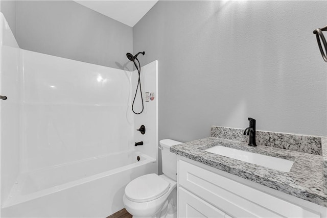 bathroom featuring shower / bathtub combination, toilet, and vanity