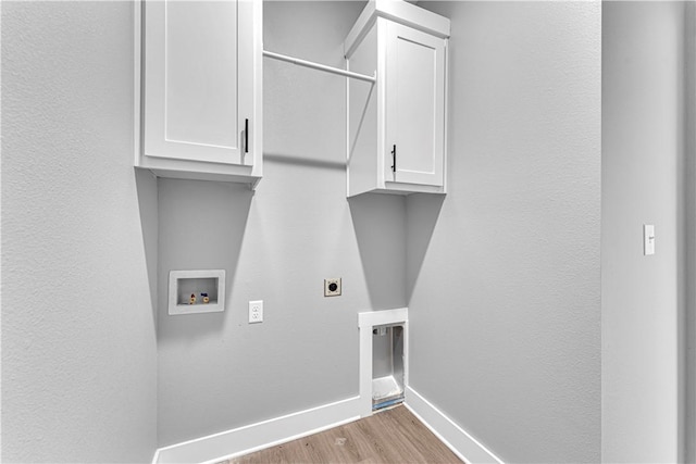 washroom featuring washer hookup, wood finished floors, cabinet space, baseboards, and hookup for an electric dryer