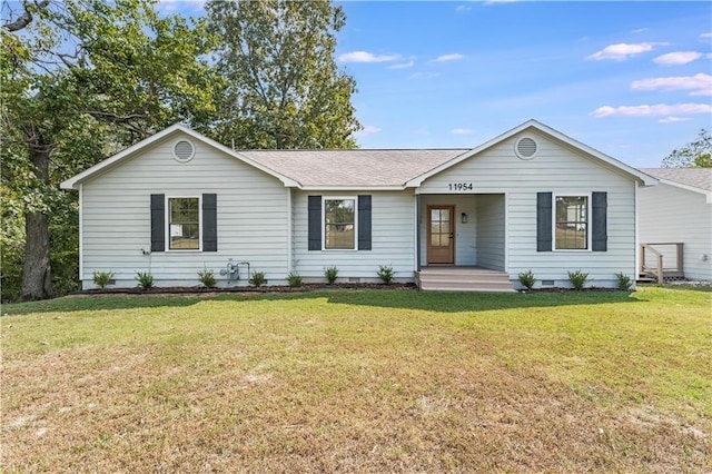 ranch-style home featuring a front lawn