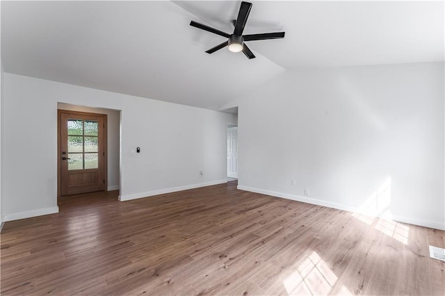 unfurnished living room featuring lofted ceiling, hardwood / wood-style floors, and ceiling fan