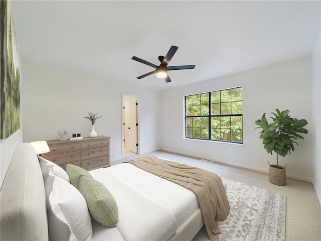 carpeted bedroom featuring ceiling fan