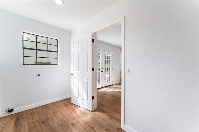 interior space featuring light hardwood / wood-style floors and french doors