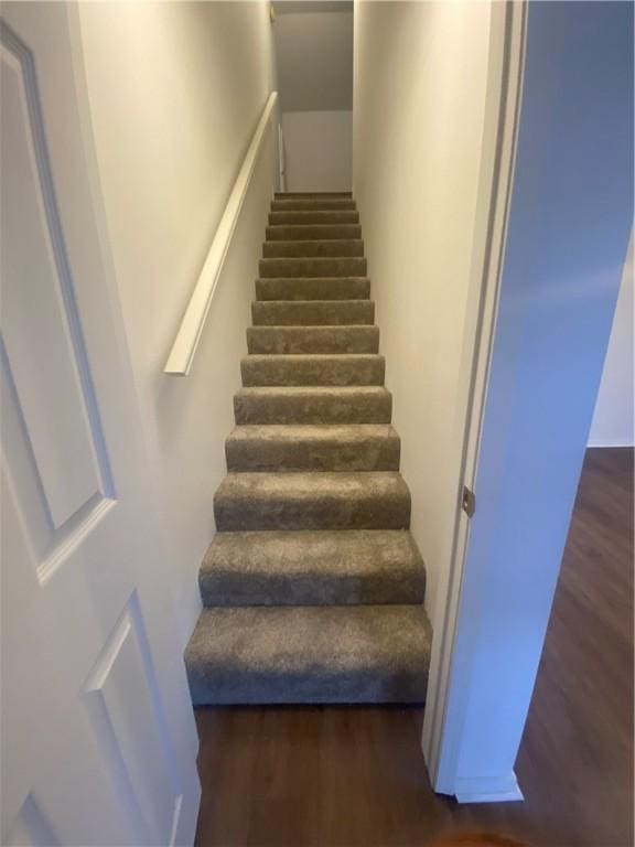 stairs with hardwood / wood-style flooring