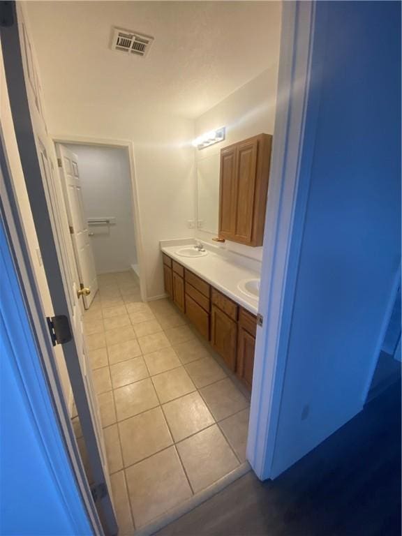 bathroom featuring vanity and tile patterned flooring