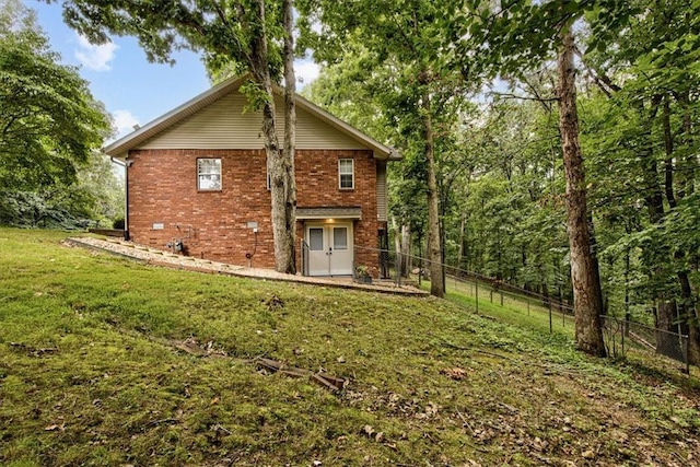 view of side of property with a yard