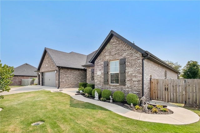 view of front of home with a garage and a front yard