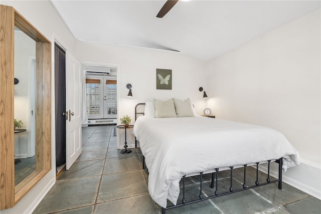 bedroom featuring an AC wall unit, ceiling fan, and french doors