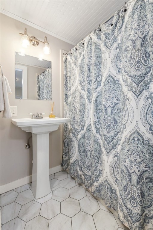 bathroom featuring crown molding, a shower with curtain, tile patterned flooring, and wooden ceiling