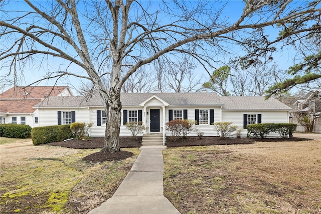 ranch-style house with a front lawn