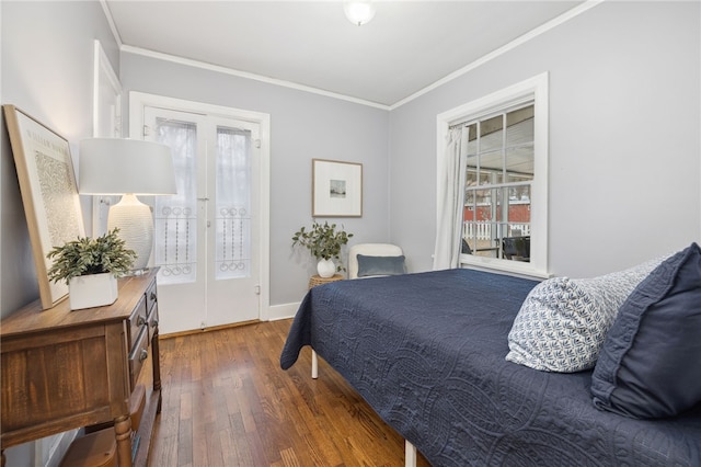 bedroom with access to exterior, ornamental molding, and dark hardwood / wood-style floors