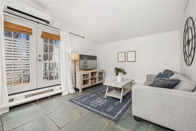 living room featuring vaulted ceiling, a wall mounted air conditioner, and french doors