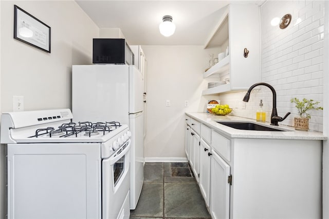 kitchen featuring sink, white cabinets, white appliances, and decorative backsplash