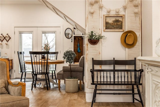 interior space with wood-type flooring and french doors