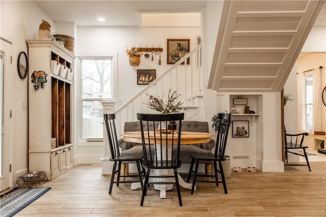 dining space with a healthy amount of sunlight and light wood-type flooring