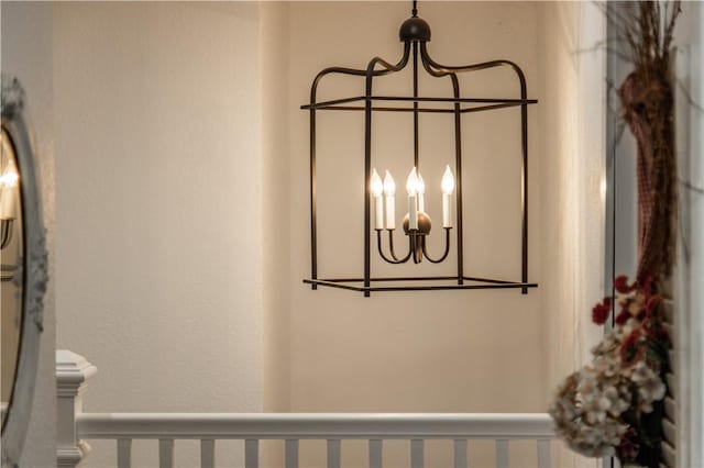 room details featuring baseboards and an inviting chandelier
