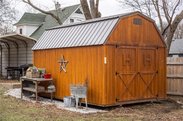 view of shed with fence