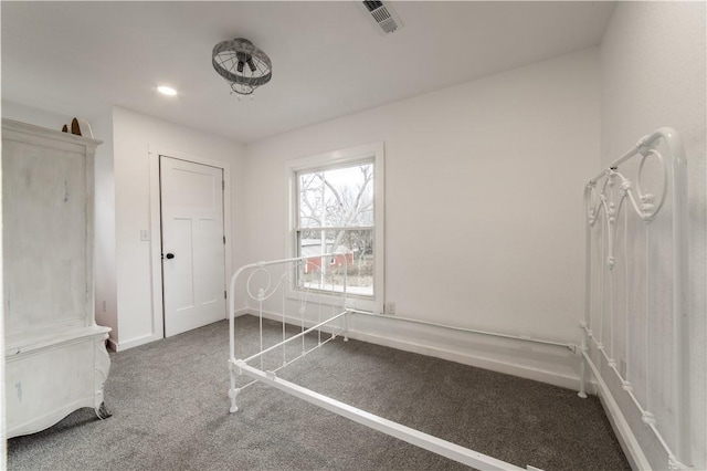 unfurnished bedroom with visible vents, baseboards, recessed lighting, and carpet floors