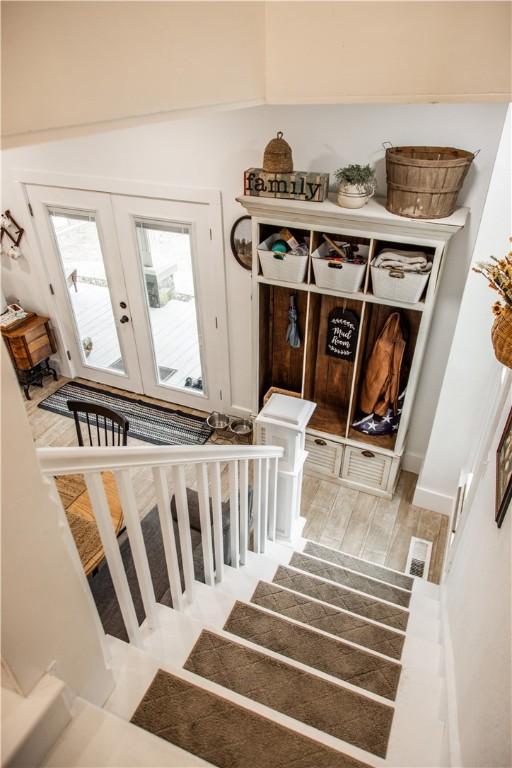 stairs featuring french doors