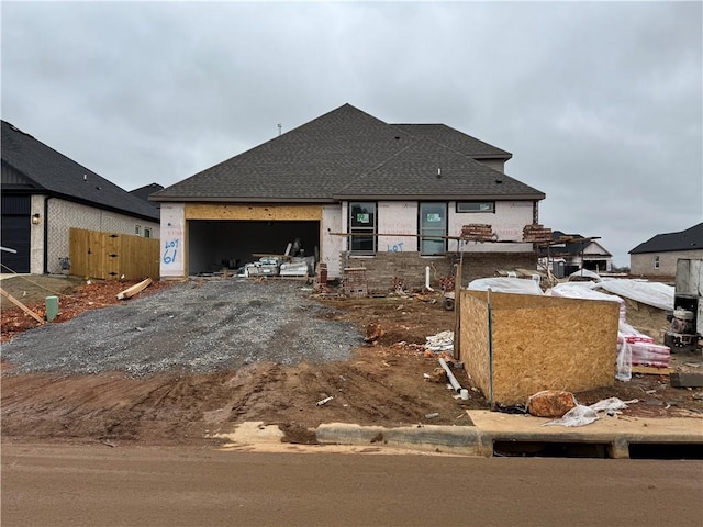 unfinished property with a garage