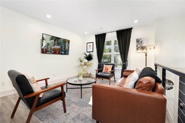 living room with light hardwood / wood-style flooring