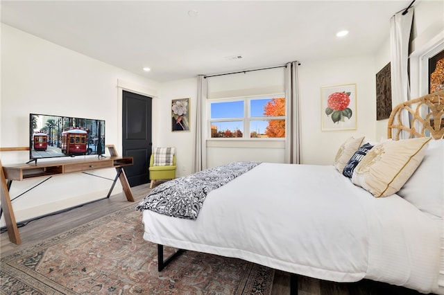 bedroom featuring hardwood / wood-style flooring