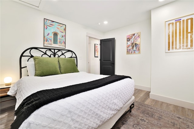 bedroom featuring hardwood / wood-style floors