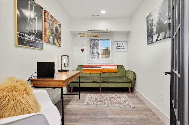 sitting room featuring wood-type flooring