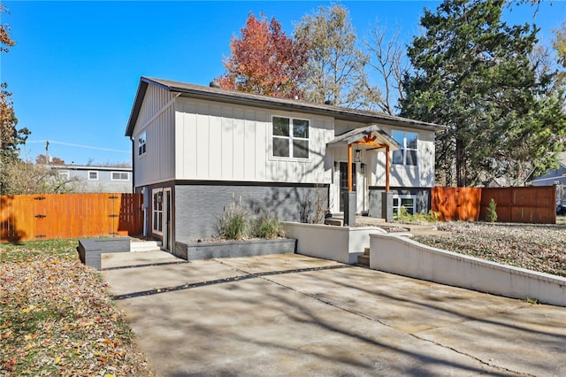 bi-level home featuring a patio area