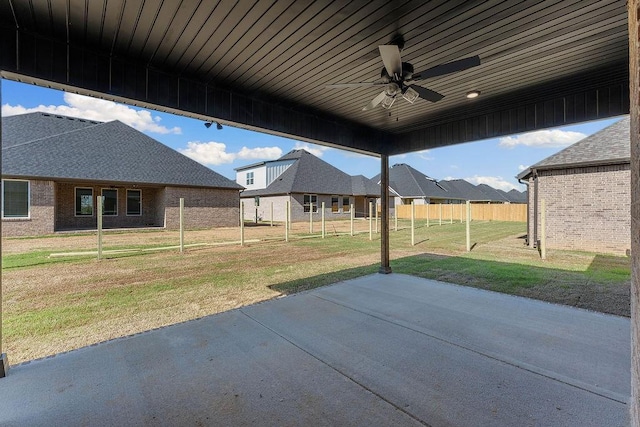 1440 Tiffany St, Centerton, AR 72719 - view of patio with fence, a ceiling fan, and a residential view