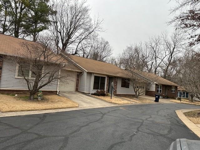 single story home featuring a garage