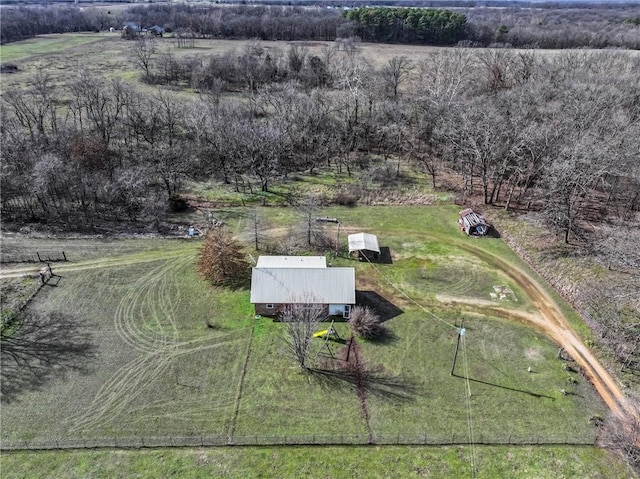 birds eye view of property with a rural view