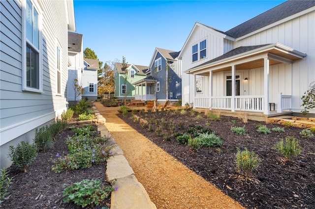 view of yard with a porch and a residential view